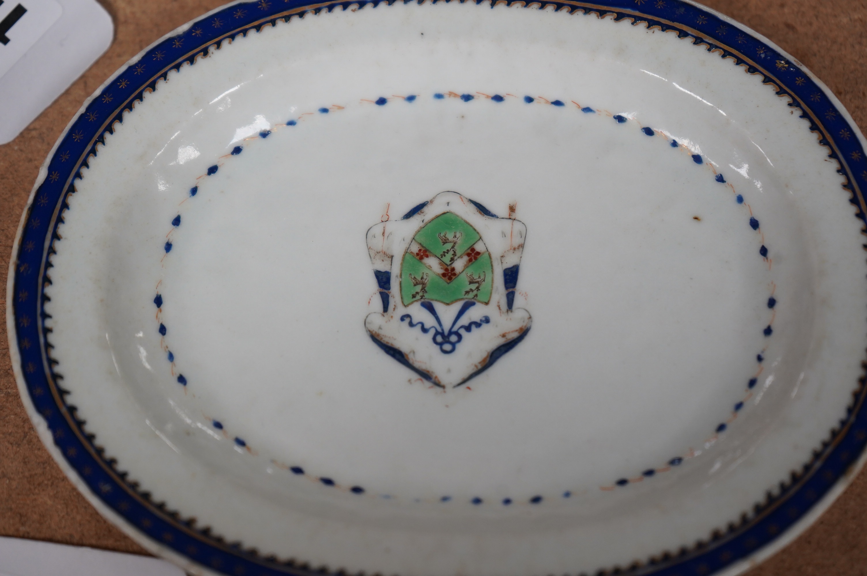 A small 18th century Chinese armorial porcelain oval dish, 16cm. Condition - fair